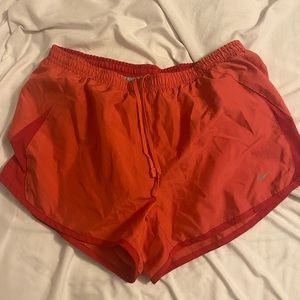 Pink/red Nike shorts. Size medium